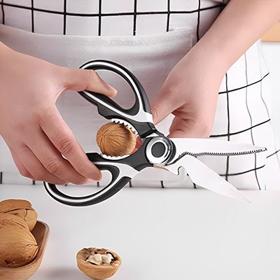 Ciseaux de cuisine peut casser des noix avec les dents de la manche