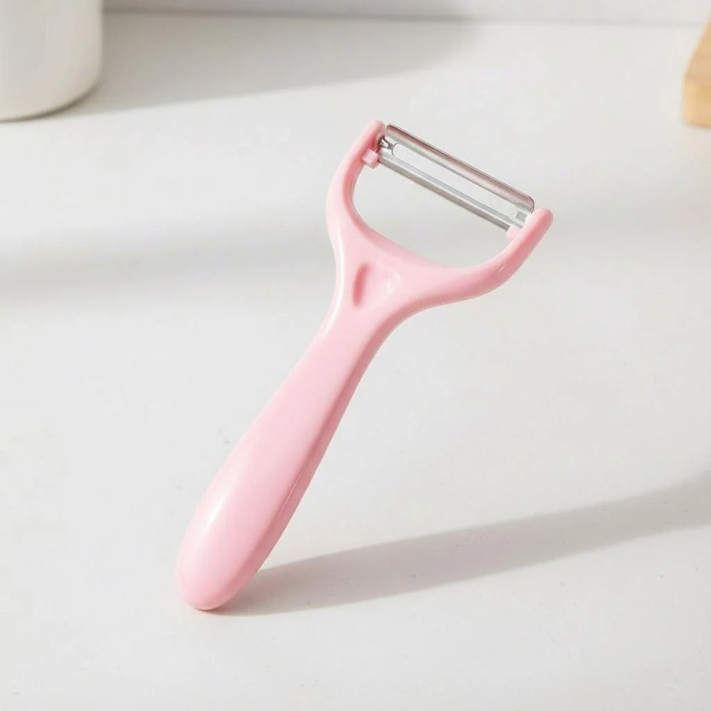 eplucheur econome poignée incurvée rose